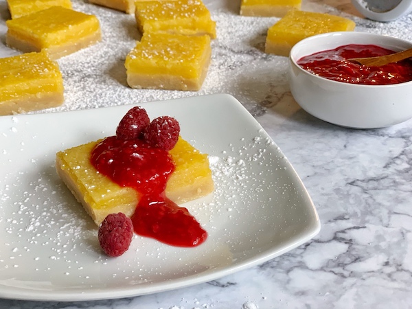 Lemon Bars with Raspberry Sauce Closeup