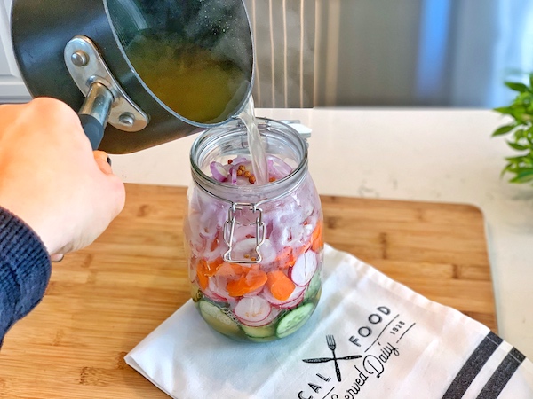 Adding the pickling liquid